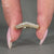 Round diamond wedding band set in yellow gold with prong setting.