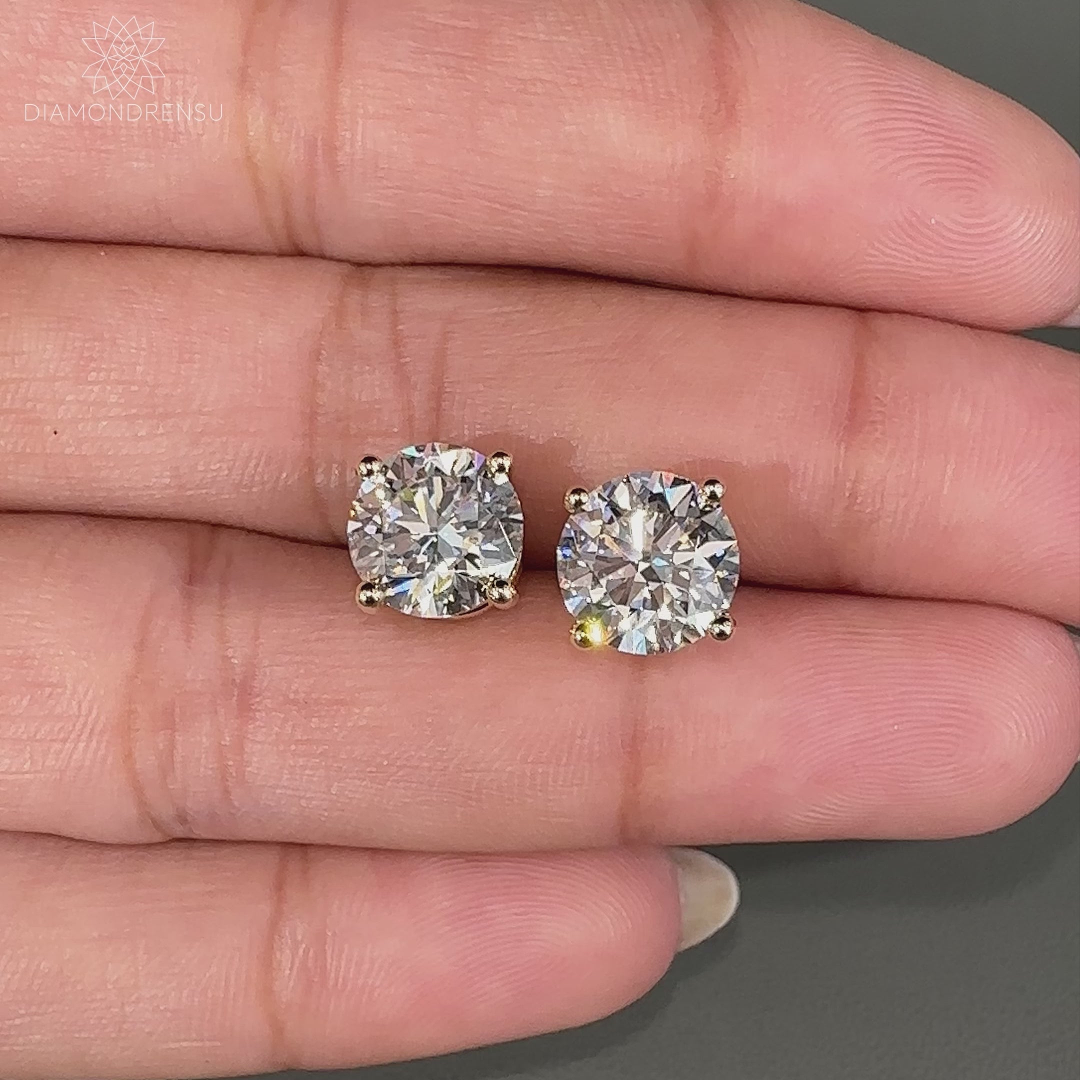 Round brilliant cut diamond earrings.