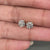 Round diamond earrings crafted in yellow gold with prong settings.