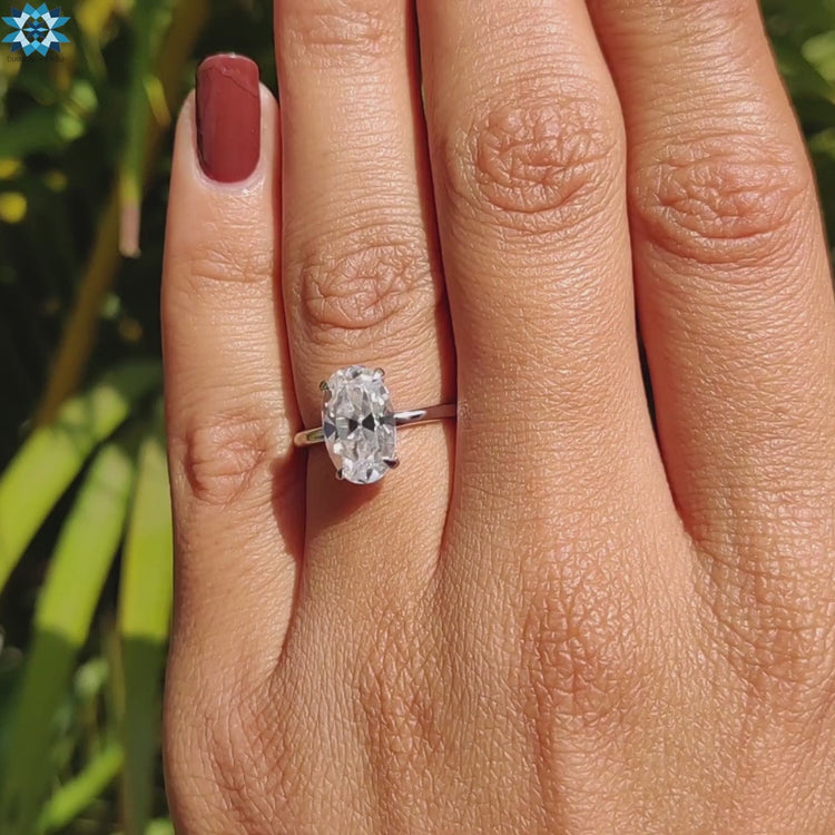 Four prong solitaire ring with Moval old European cut stone.
