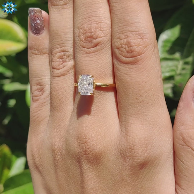 Four prong hidden halo moissanite engagement ring in white gold.
