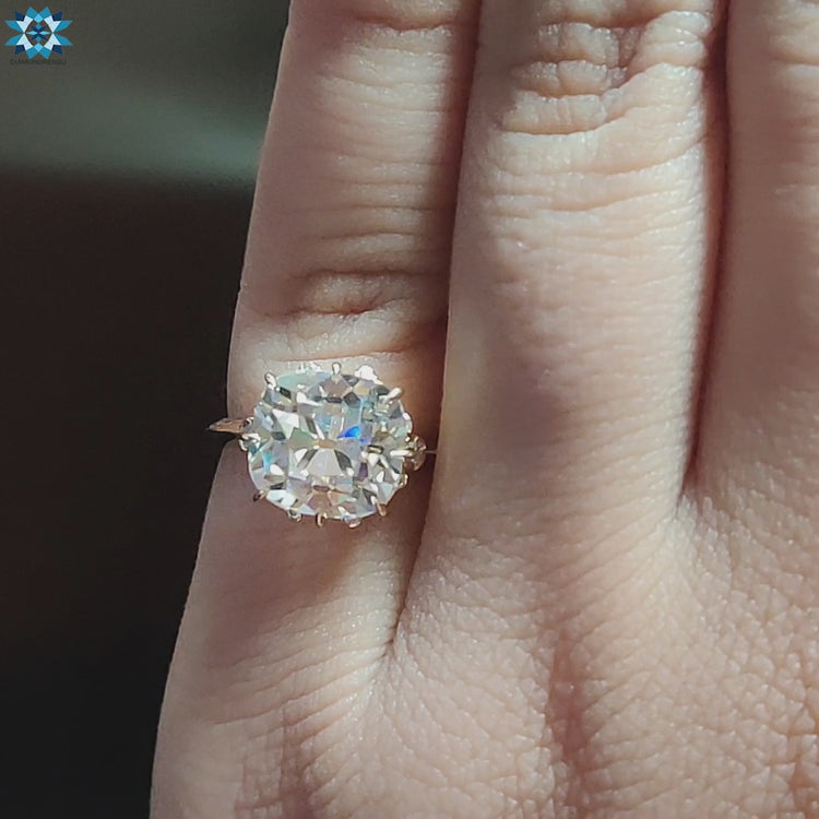 Vintage cushion engagement ring with yellow gold band.
