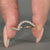 Round cut diamond band with a simple and clean curved shape.