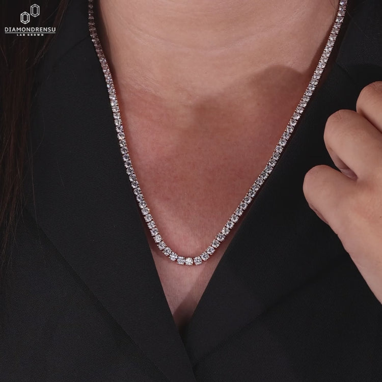 Round diamond necklace designed in rose gold with handmade detail.
