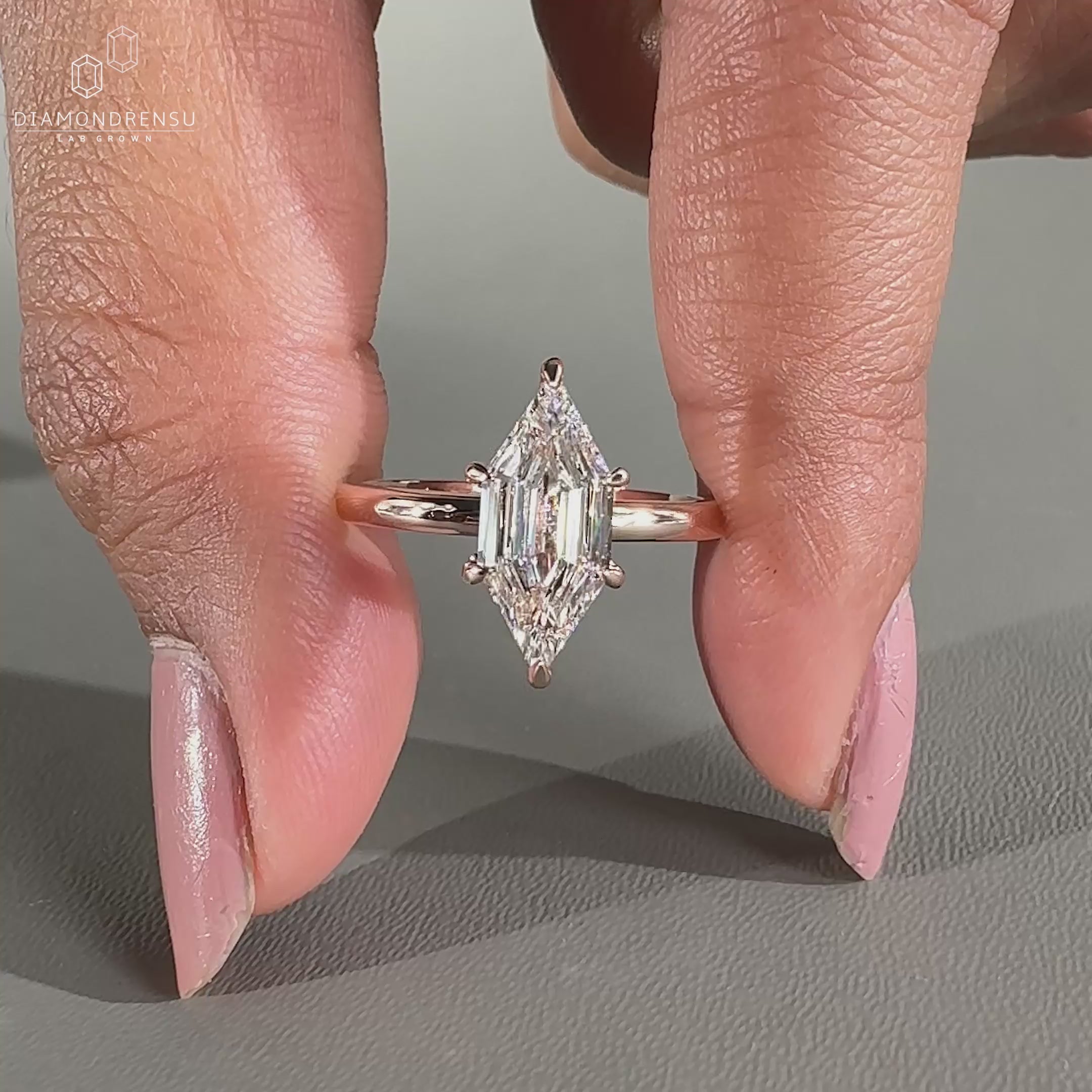 Solitaire diamond ring featuring a single centre stone on a slim band.
