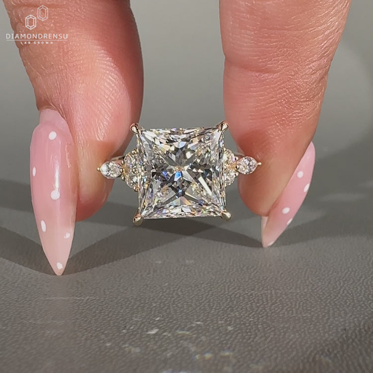 Seven stone ring with tapered shank band design.