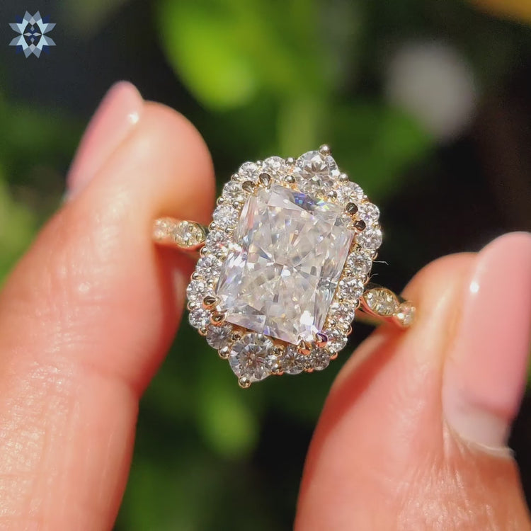 Art Deco style radiant cut ring with double claw prong and peekaboo setting.
