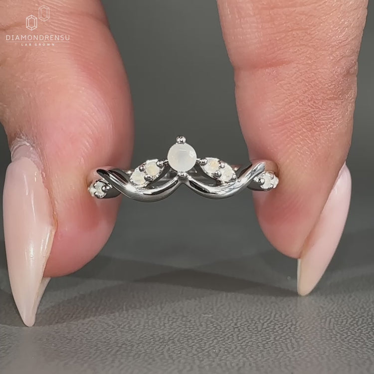 Cluster wedding band featuring round cut moonstone diamond.
