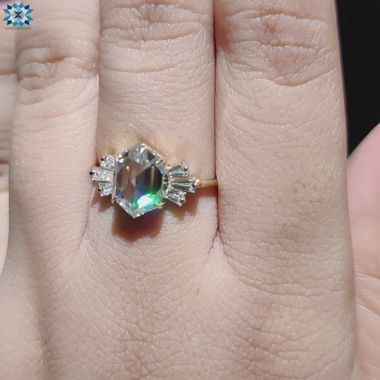 Handmade jewelry with rose cut moissanite and baguette sides.
