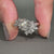 Hexagon ring with Marquise and Round side stone.
