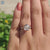 Round and Portuguese cut moissanite ring with prong setting.

