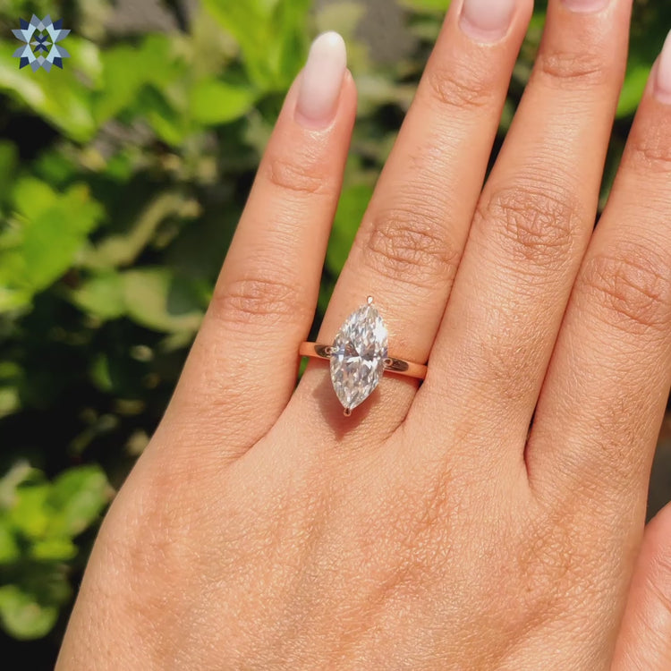 Marquise cut moissanite engagement ring with prong setting
