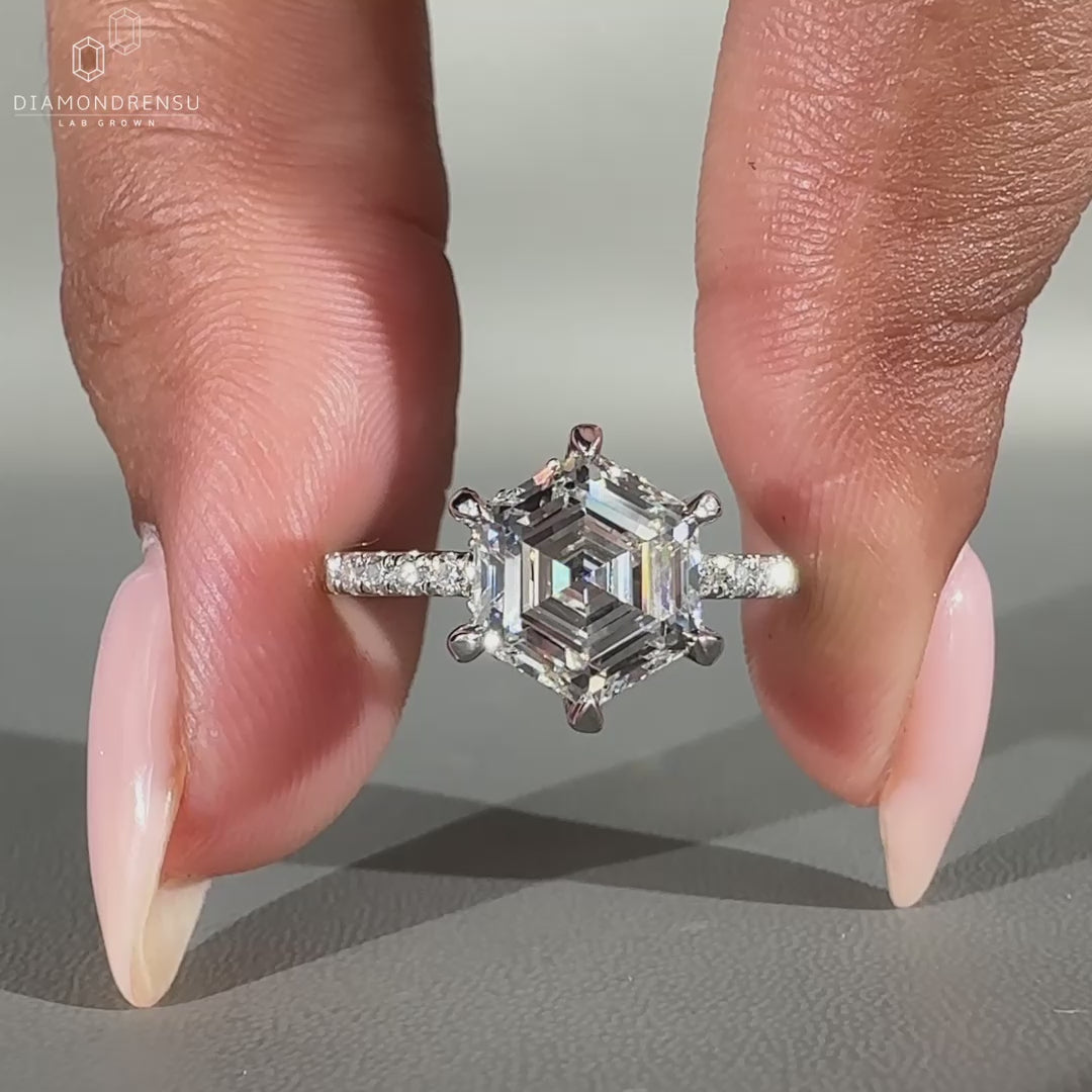White gold ring featuring round cut pave and 6 prong claw setting.
