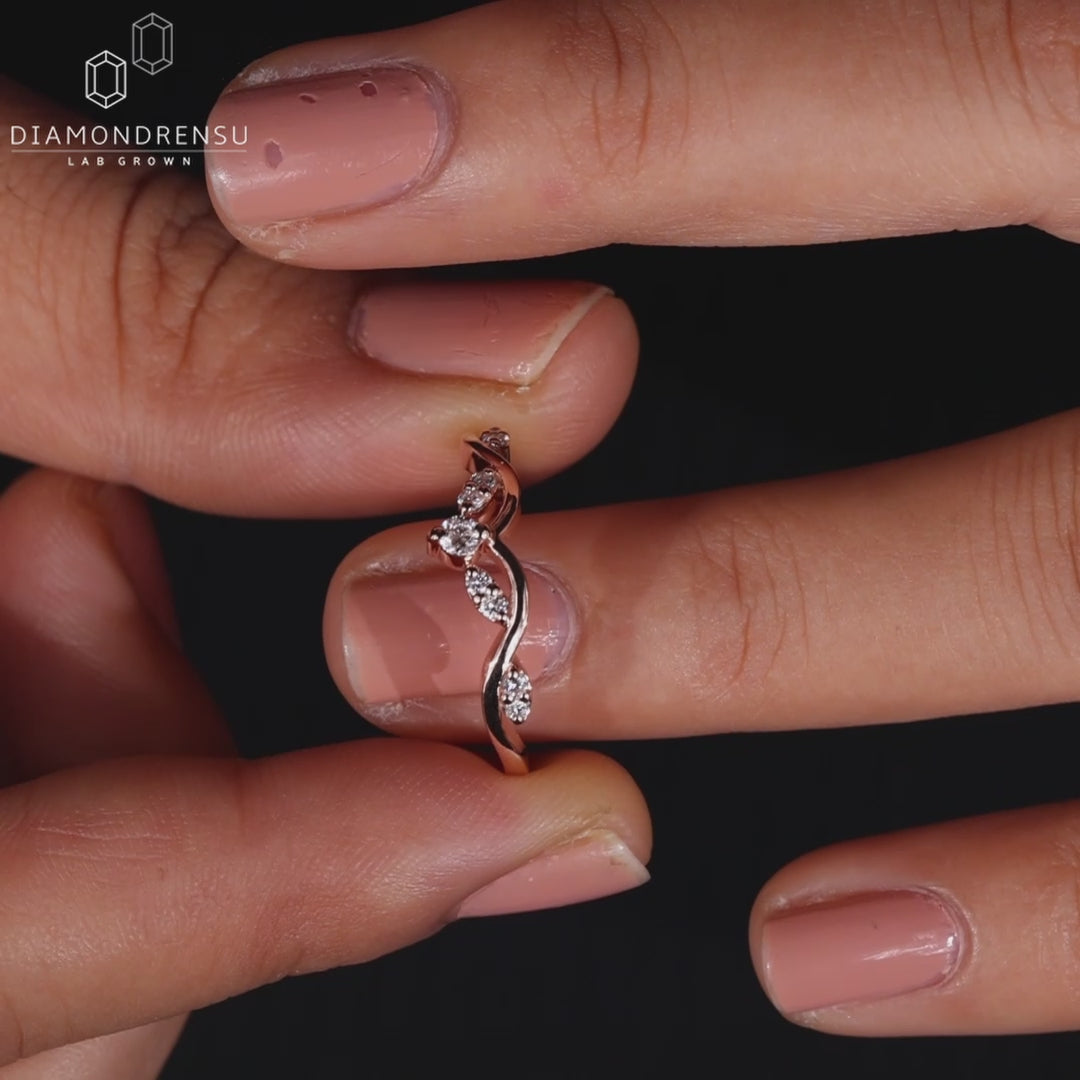 Rose gold tiara-style diamond wedding band.
