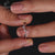 Rose gold tiara-style diamond wedding band.
