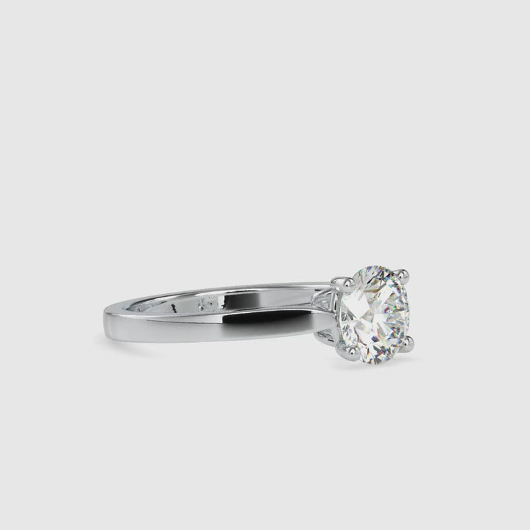 Solitaire diamond engagement ring with round cut and gold option.