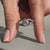 Old mine cushion cut diamond ring with compass prong setting.
