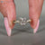 Heart cut diamond ring with twisted shank and prong setting.