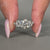 Cluster diamond ring featuring round cut lab grown stones.
