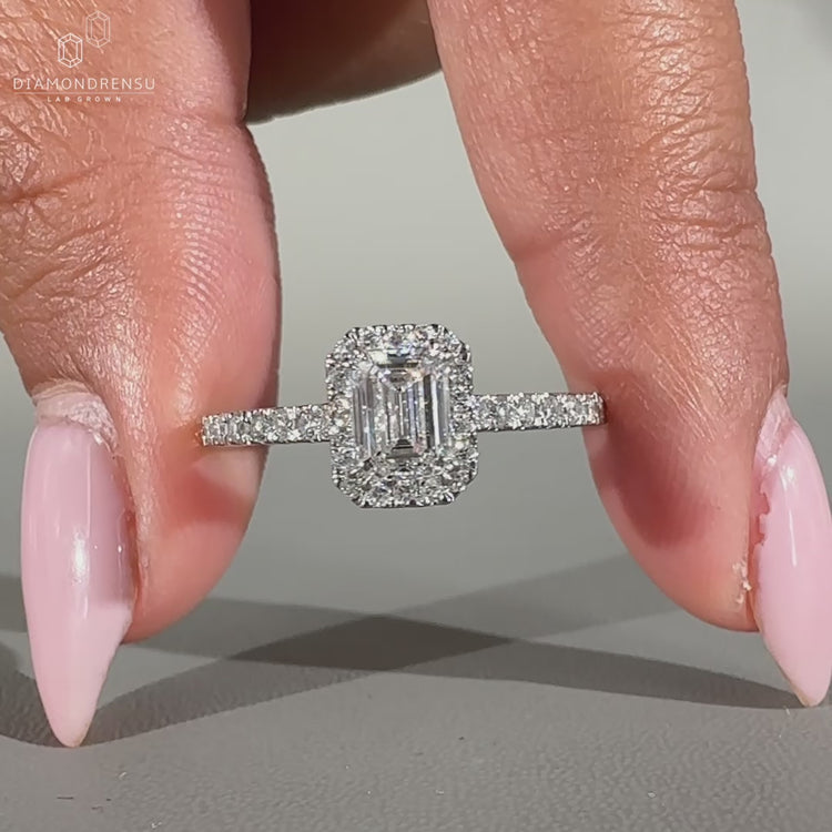 Emerald Cut Engagement Ring crafted in white gold diamond ring.
