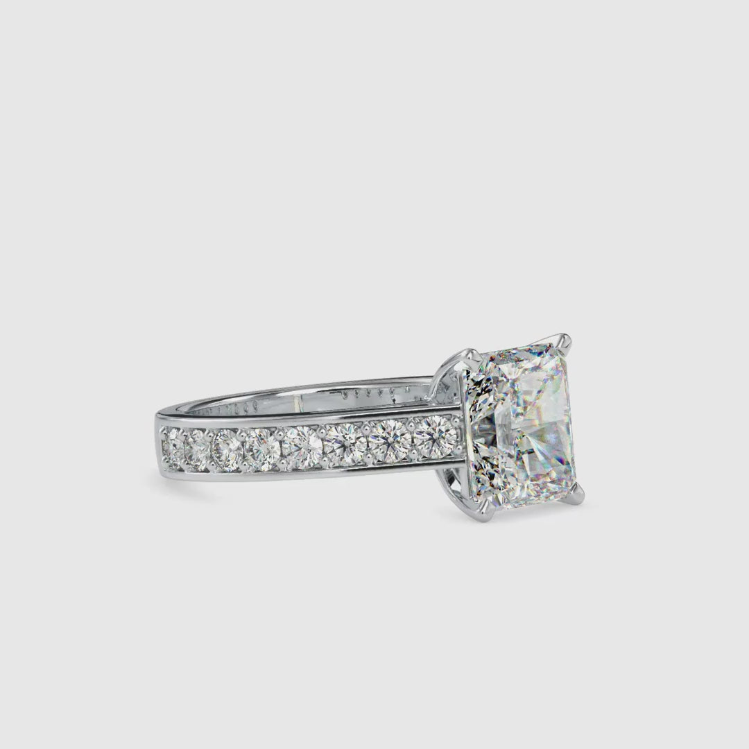 Radiant cut diamond ring with pave setting for extra brilliance
