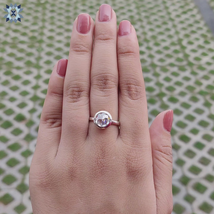 Buy Moissanite engagement ring with bezel design and handmade craftsmanship.
