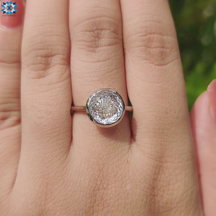 Unique white gold engagement ring with Portuguese cut gem.
