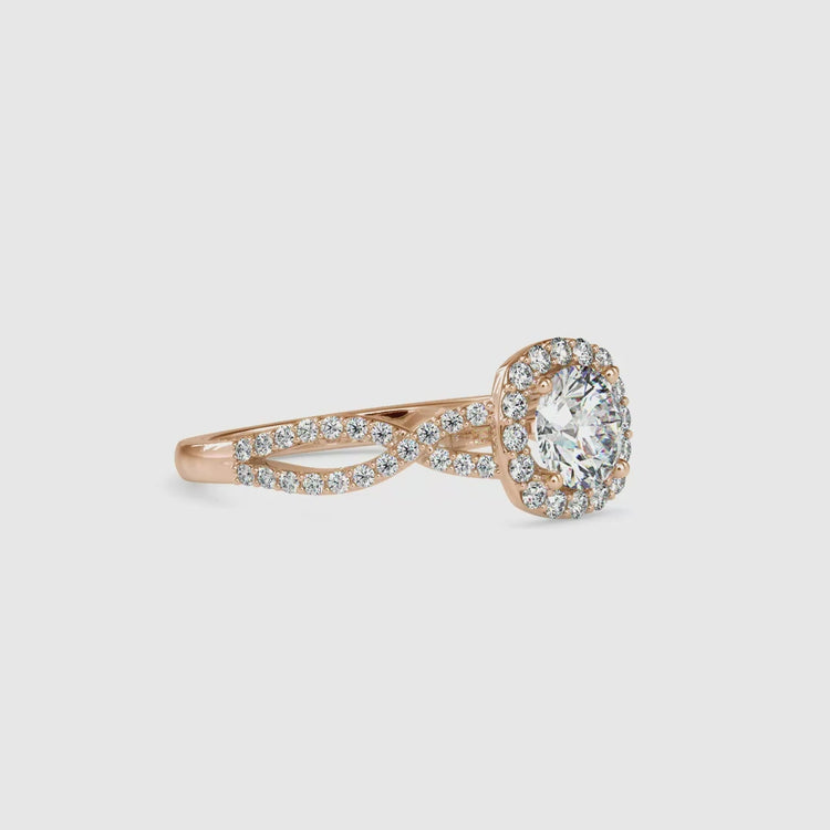 Handmade twist band ring with round lab grown diamond in halo.