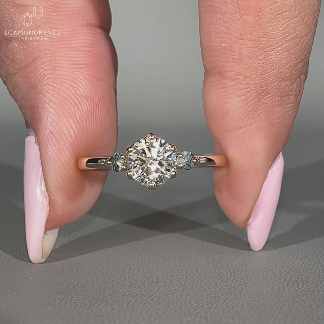 Round cut diamond ring in a polished style.
