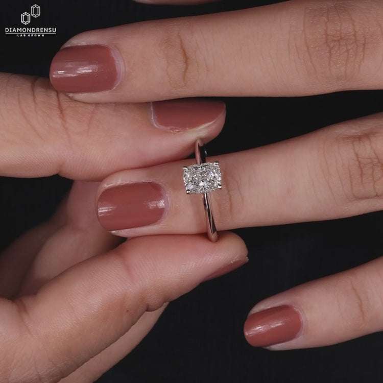 Handmade ring with an elongated cushion engagement ring design and pave setting.
