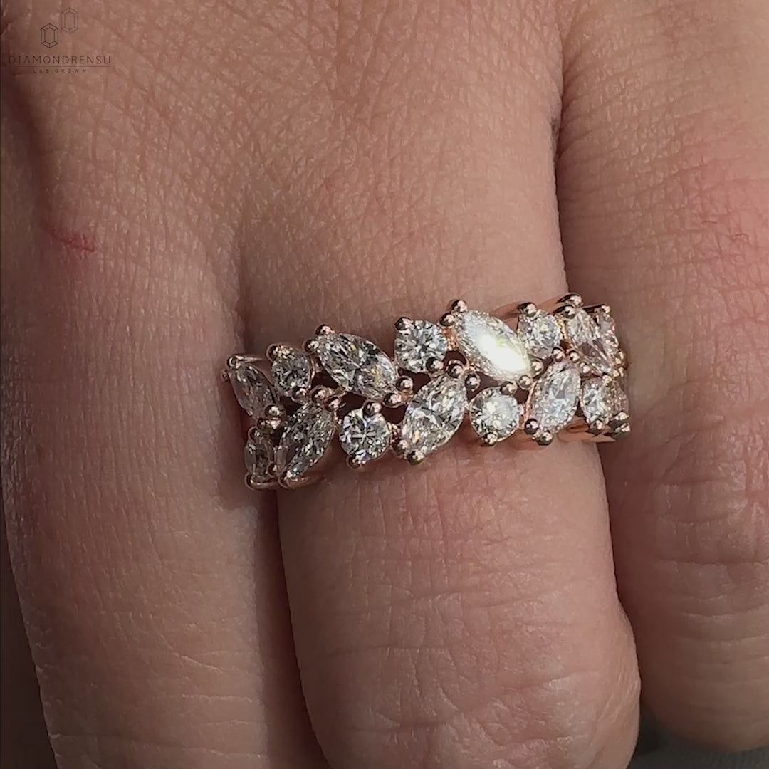 Marquise and round diamond wedding band in rose gold.
