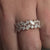 Marquise and round diamond wedding band in rose gold.
