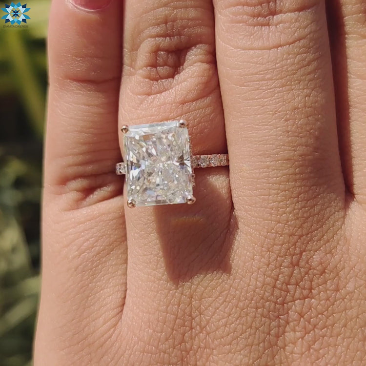 Handmade moissanite ring with radiant cut center.
