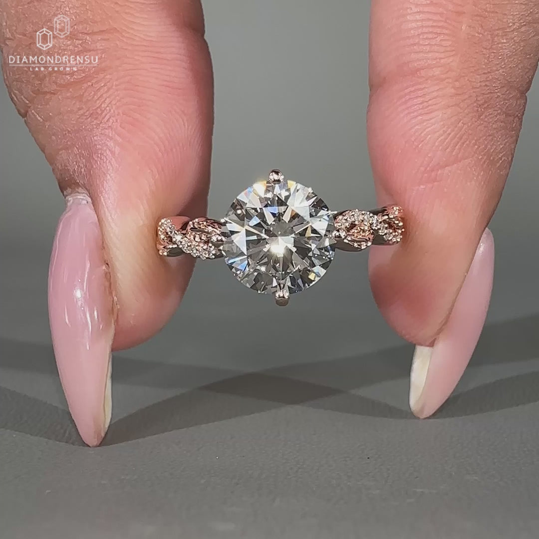 Round diamond engagement ring in compass prong setting
