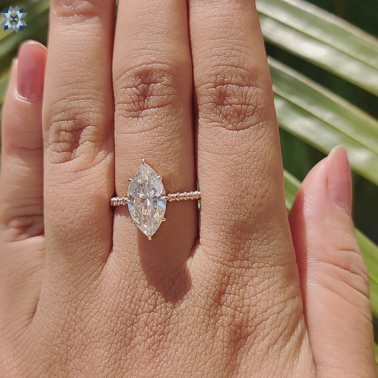 Buy moissanite ring with twisted band and claw prong.
