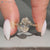 Oval solitaire ring with Art Deco style details.