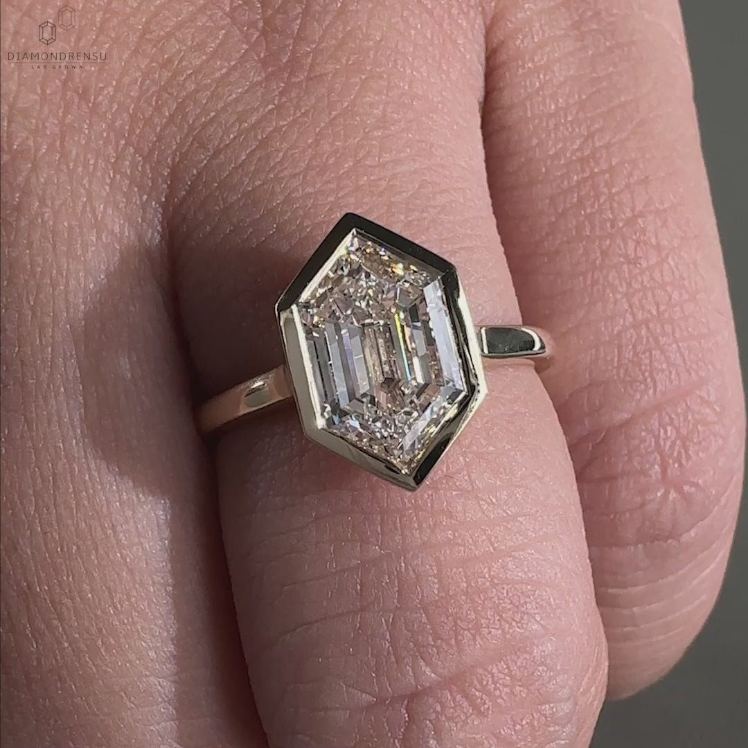 Bezel set engagement ring in yellow gold engagement ring style.
