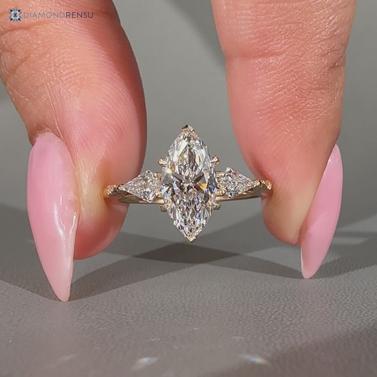 Three stone marquise ring with art deco style.