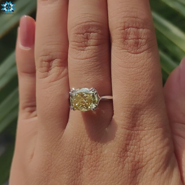 White gold engagement ring with hidden halo and knife edge band.
