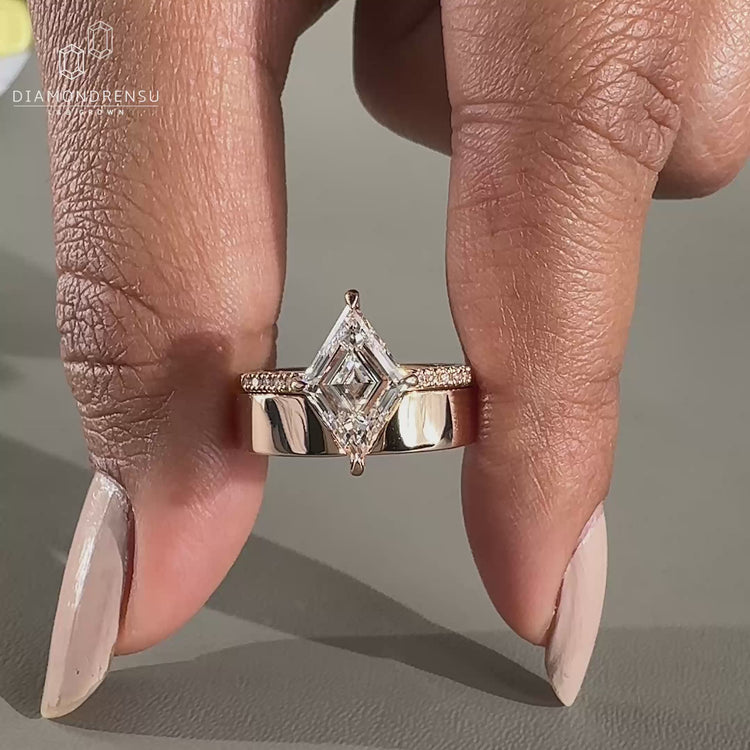 Lozenge cut ring set in a delicate pave setting for a modern bridal look.
