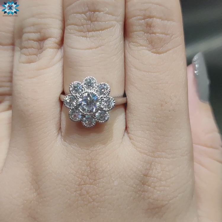 Moissanite bezel engagement ring with halo and cathedral silhouette.
