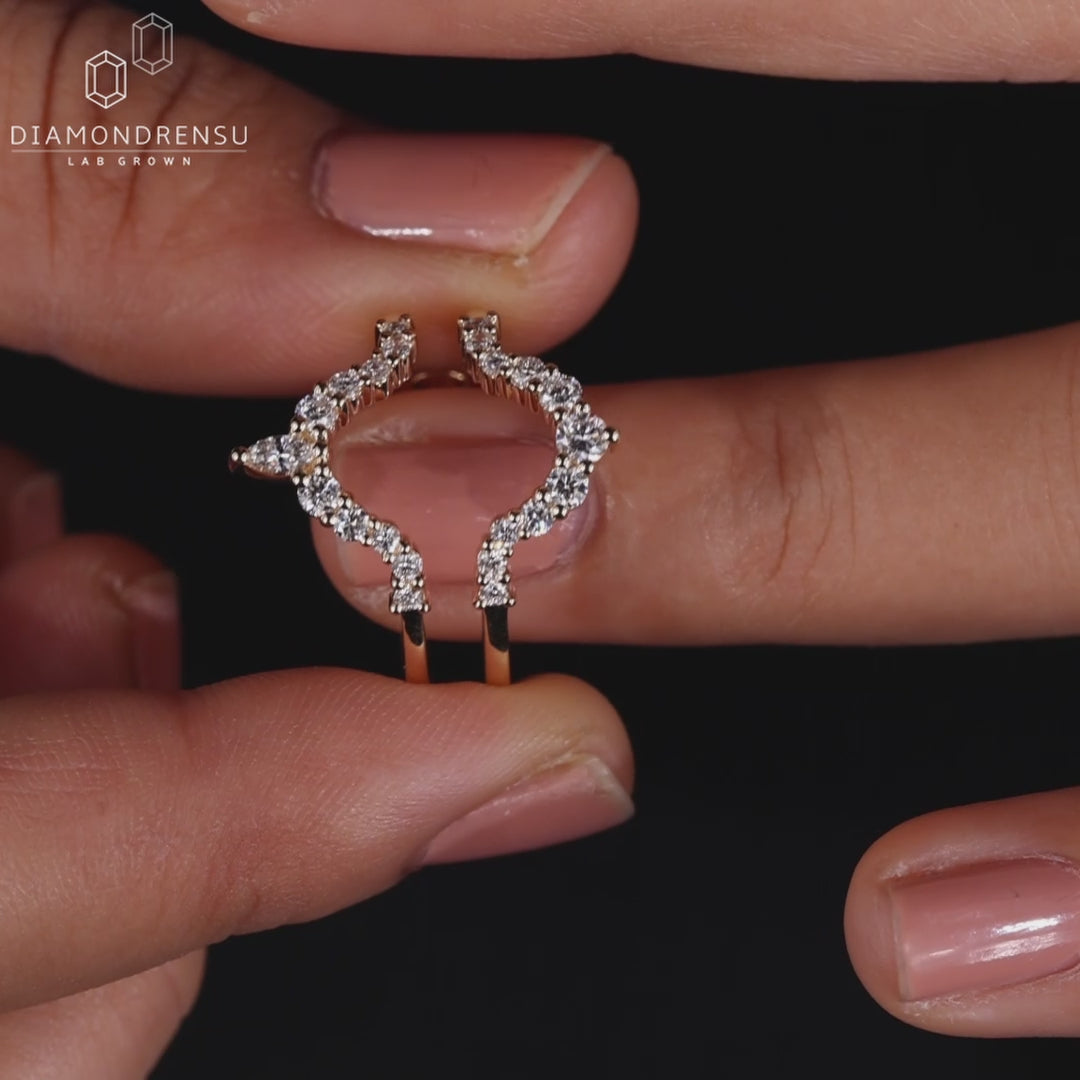 Marquise and round diamond curved wedding band.
