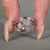 Pear cut diamond ring with round side stones.
