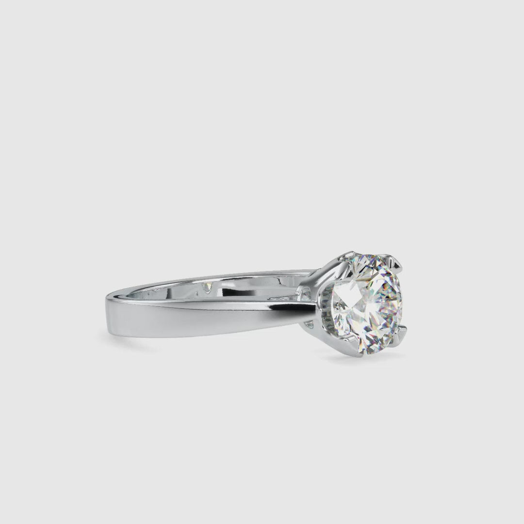 Basket setting engagement ring featuring a round solitaire diamond.