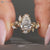 Nature inspired pear cut diamond ring with bypass setting.