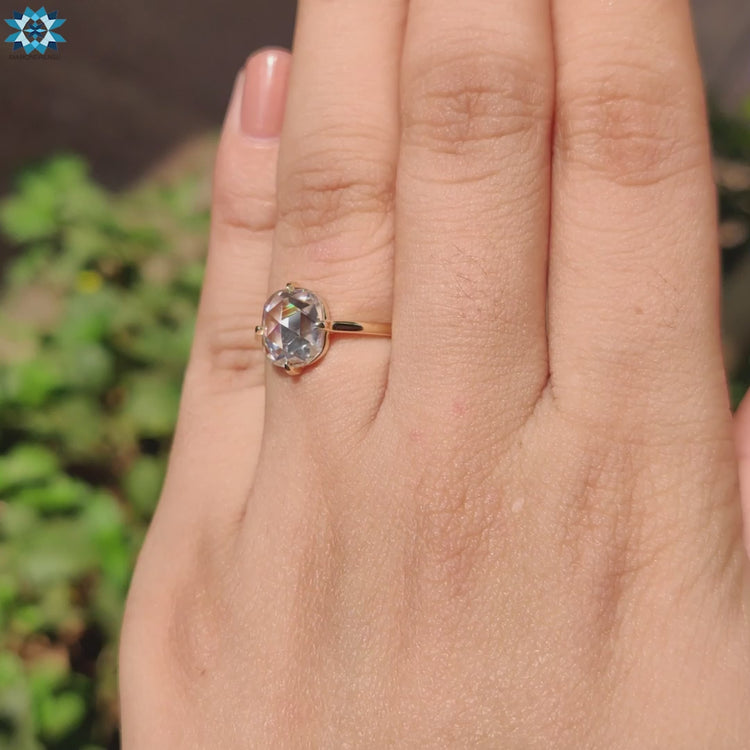 Cushion moissanite ring in compass prong setting.
