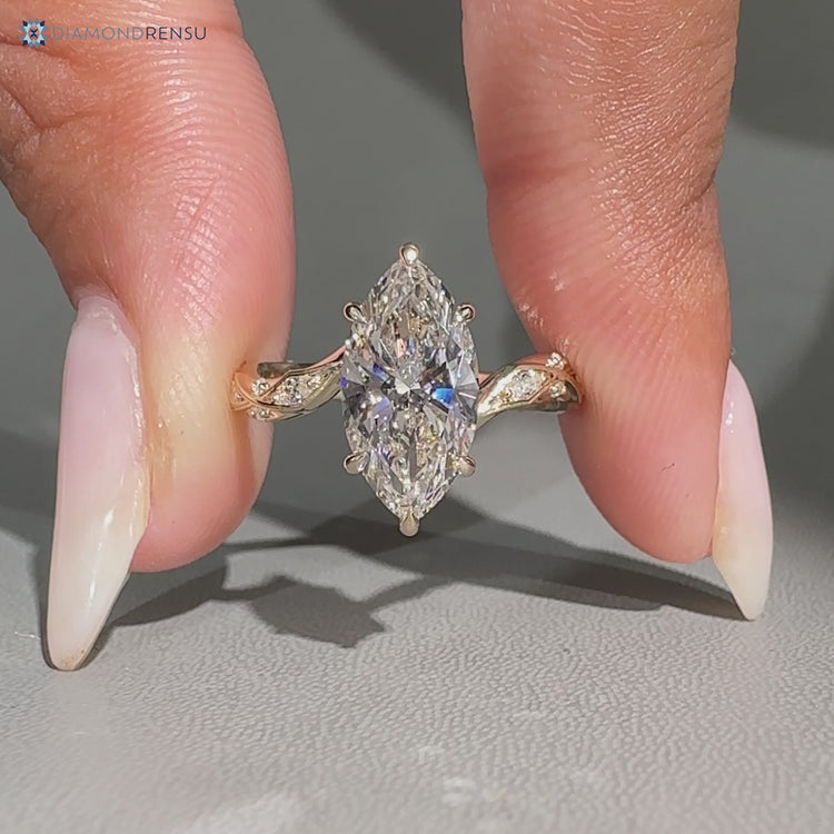 Handmade marquise diamond ring with bypass setting.