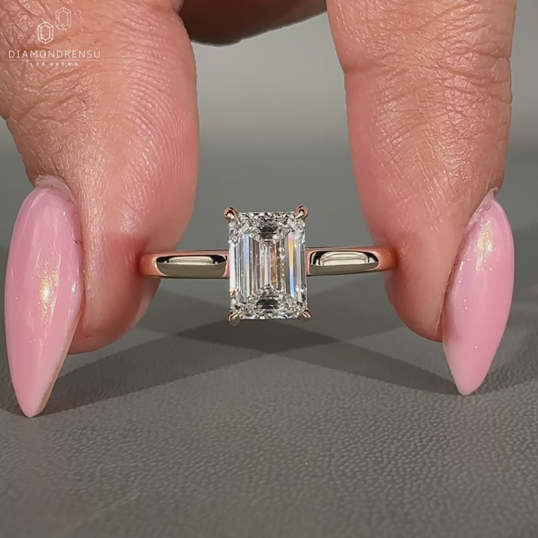 Solitaire diamond ring featuring a cathedral setting.
