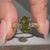 Nature inspired oval engagement ring with milgrain details.