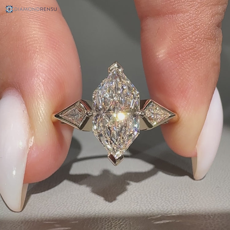 Dutch marquise engagement ring with three stone style.